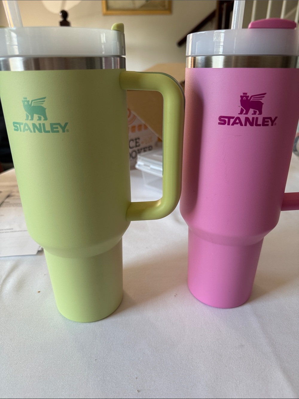 Stanley Pink and Light Green Insulated Travel Mugs with Handles